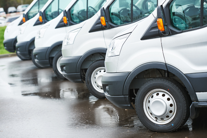 freight services. commercial delivery vans in row at transporting carrier shipping service company parking